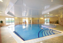 Swimming pools with suspended ceilings