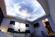 Printed sky ceiling in bedroom